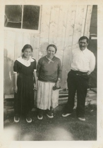 Image of Eskimo [Inuit] mother, father and daughter